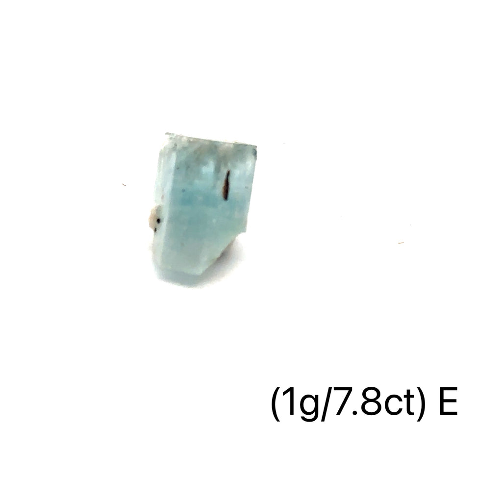 Raw Aquamarine with Schorl Gemstone 1g E  on white close up overview