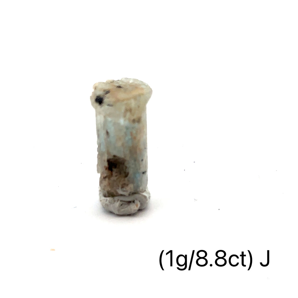 Raw Aquamarine with Schorl Gemstone 1g J on white close-up overview