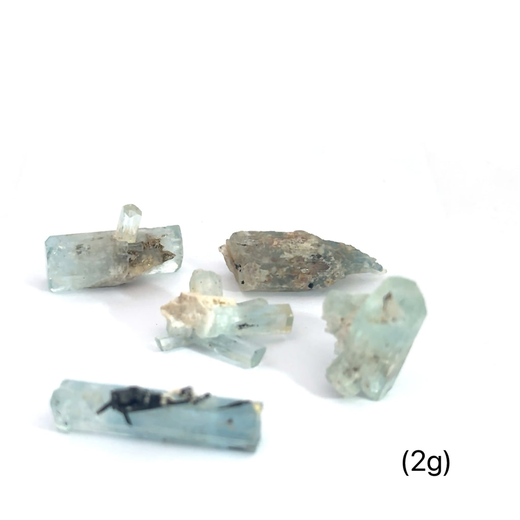 Raw Aquamarine with Schorl Gemstone 2g on white overview 