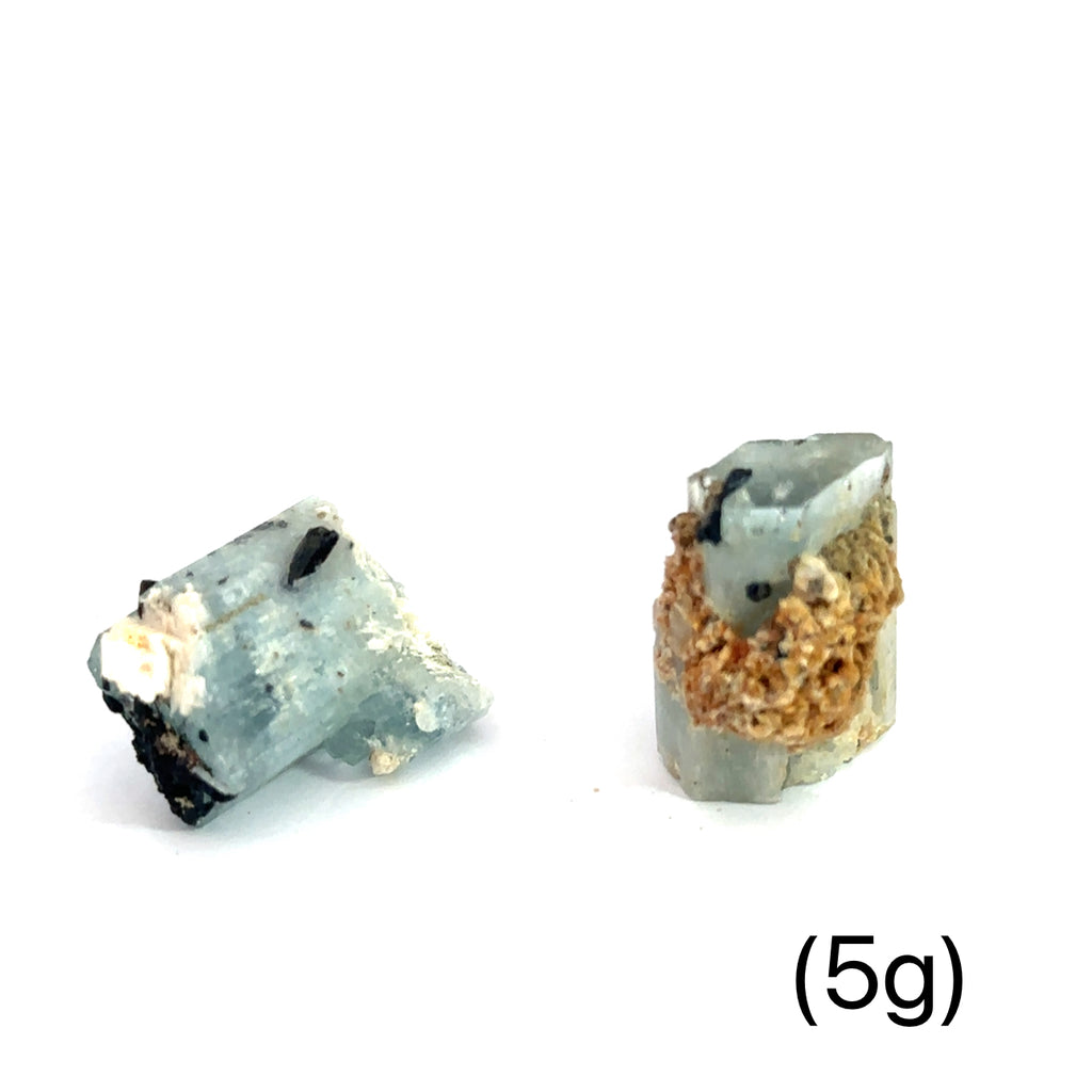 Raw Aquamarine with Schorl Gemstone 5g on white overview 