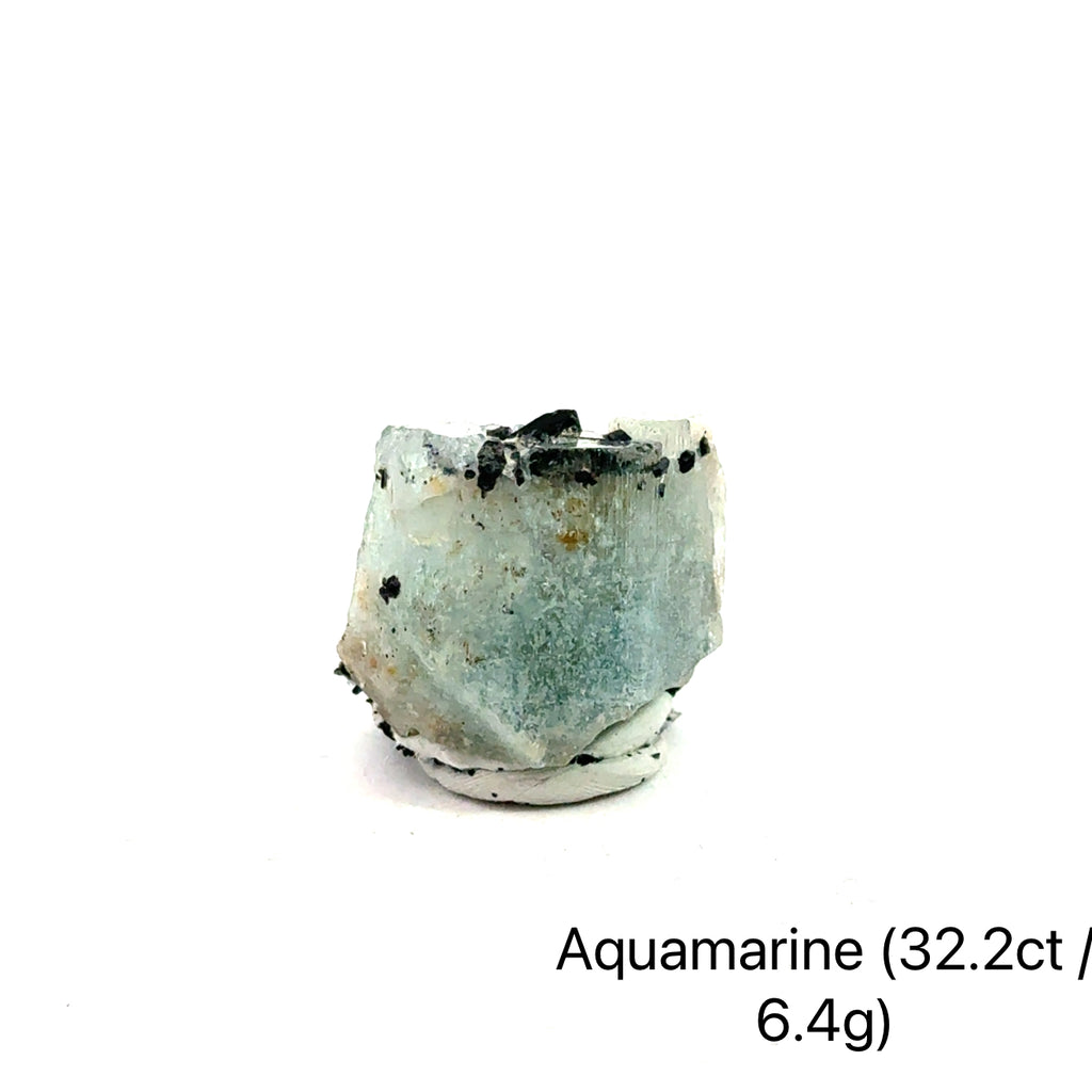 Raw Aquamarine with Schorl Gemstone 6.4g on white 