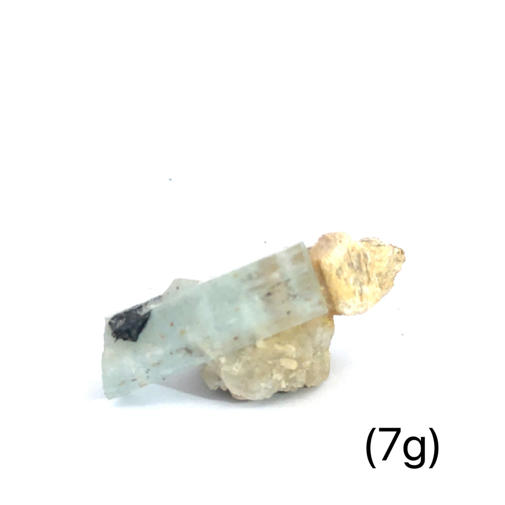 Raw Aquamarine with Schorl Gemstone 7g on white overview 