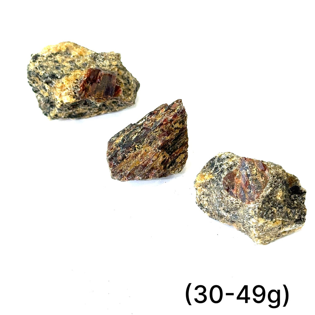 Raw Garnet stone for root chakra grounding and energy clearing (30-48g) on white overview