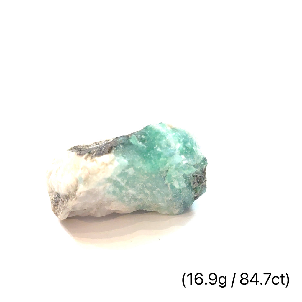 Raw Grade‑A Emerald Gemstone on white 16.9/84.7ct  overview