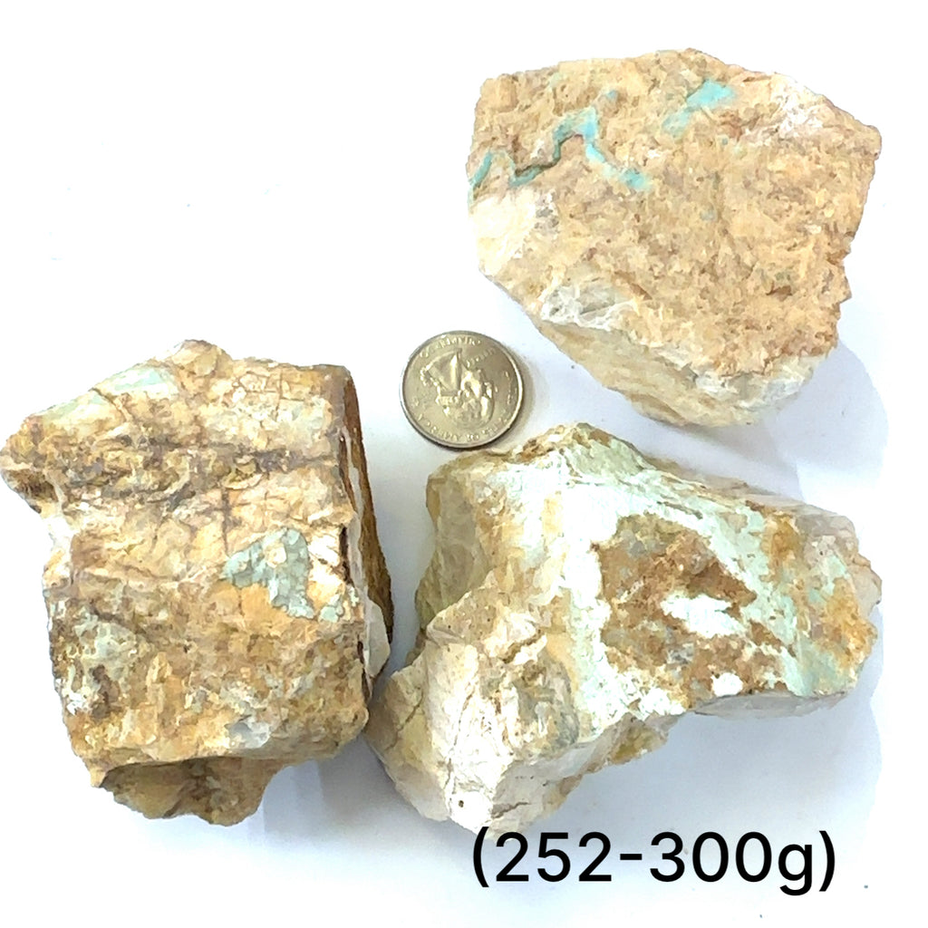 Raw Royston Turquoise Gemstone grouping (252-300g) on white center overview