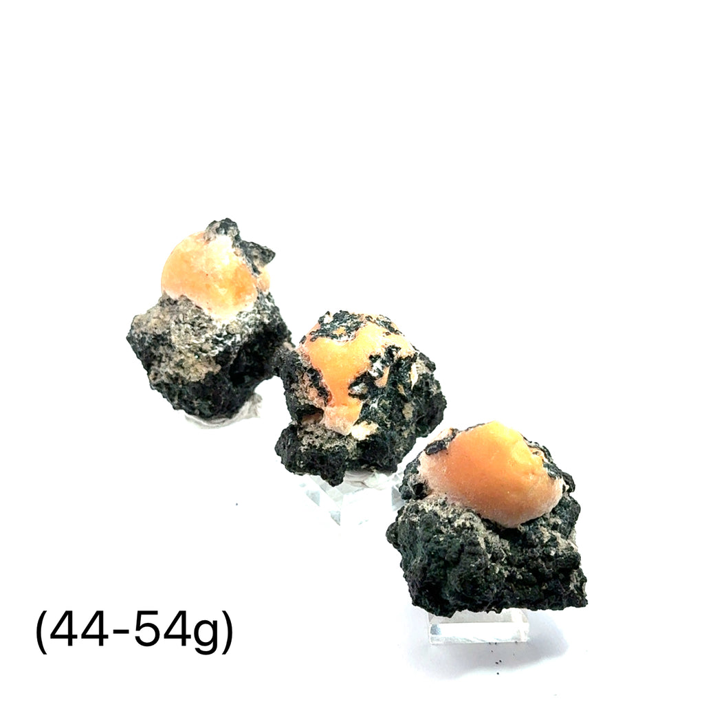 Raw Thomsonite Gemstone 44=54g grouping on white front view