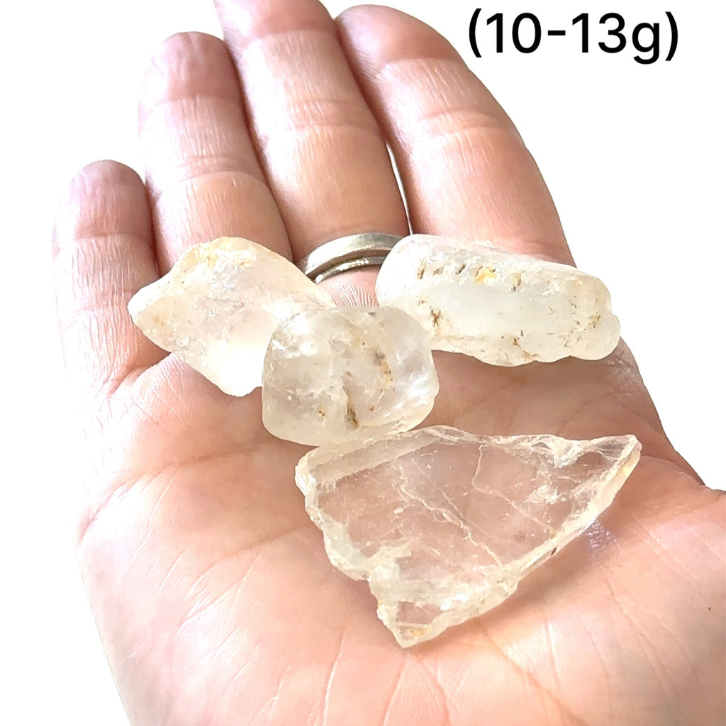 Raw Topaz stone for Crown and Solar Plexus chakra alignment grouping of gemstones (10-13g)  in hand to show a close-up overview