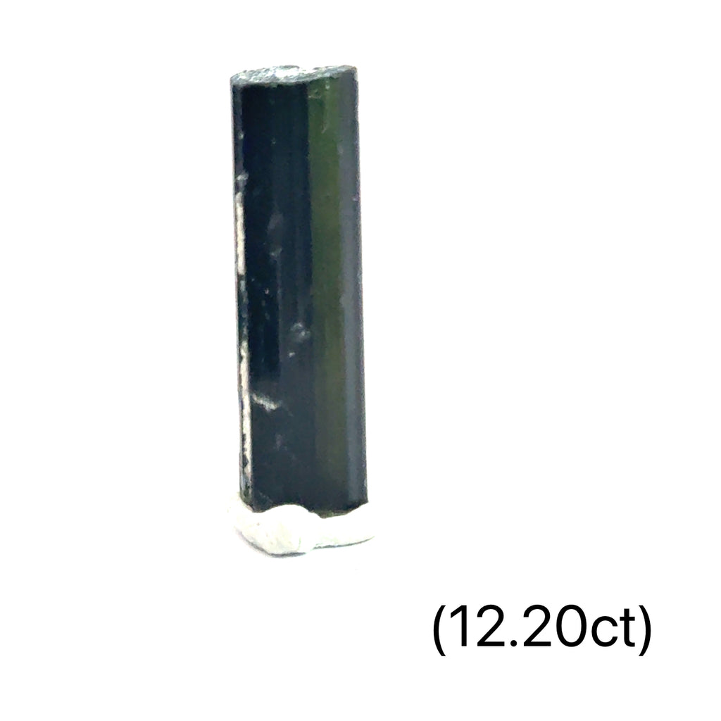 Raw Tourmaline stone for heart chakra balance and emotional healing (12.20ct) on white and in finger tips front view
