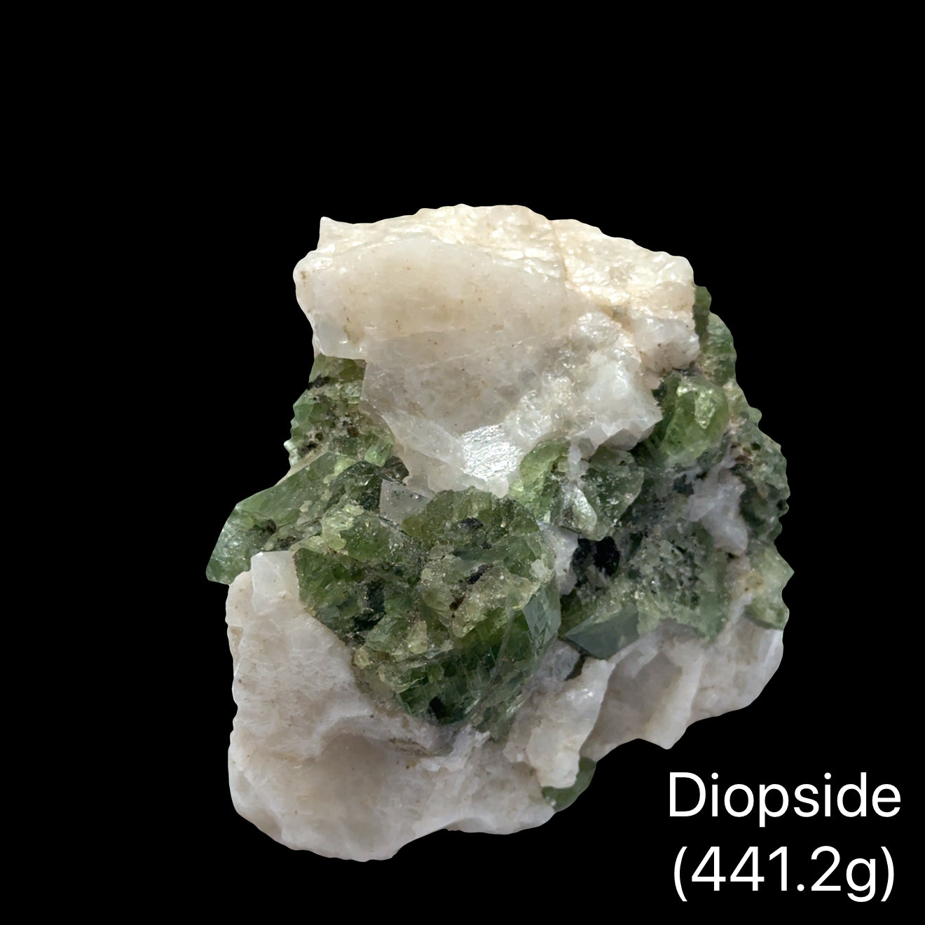 Raw diopside crystal cluster from Sar-e-Sang Afghanistan in deep forest green for heart chakra healing emotional release and earth connection (441.2g) on a black background, front view. 