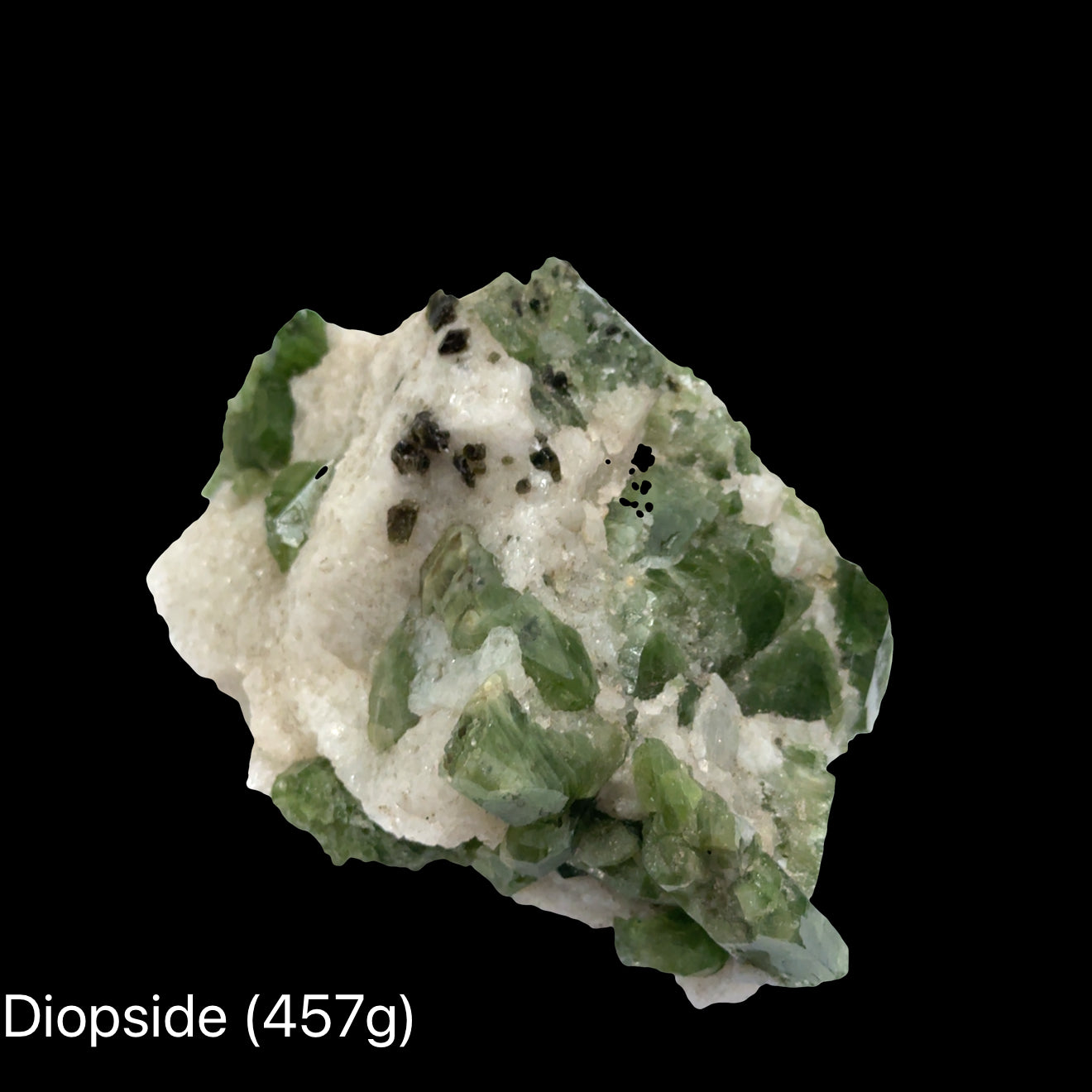 Raw diopside crystal cluster from Sar-e-Sang Afghanistan in deep forest green for heart chakra healing emotional release and earth connection (457g) on a black background, front view. 