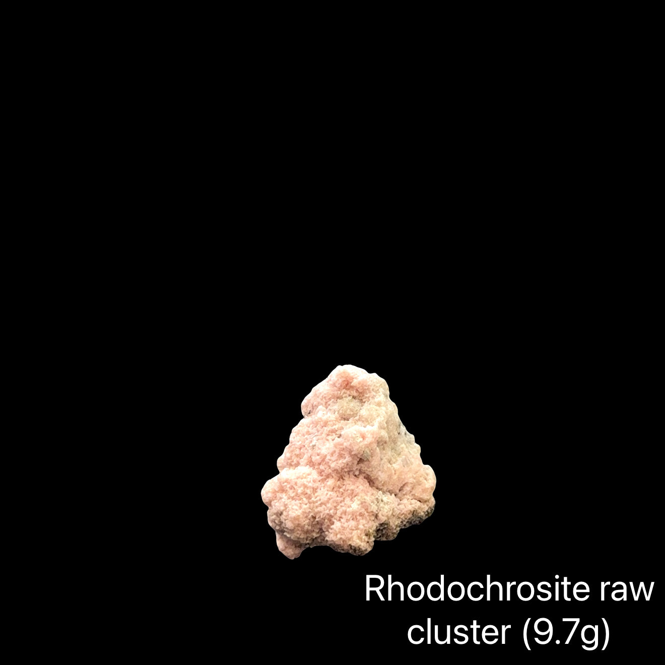 Raw rhodochrosite cluster on a black background with text indicating weight (9.7g), front view.