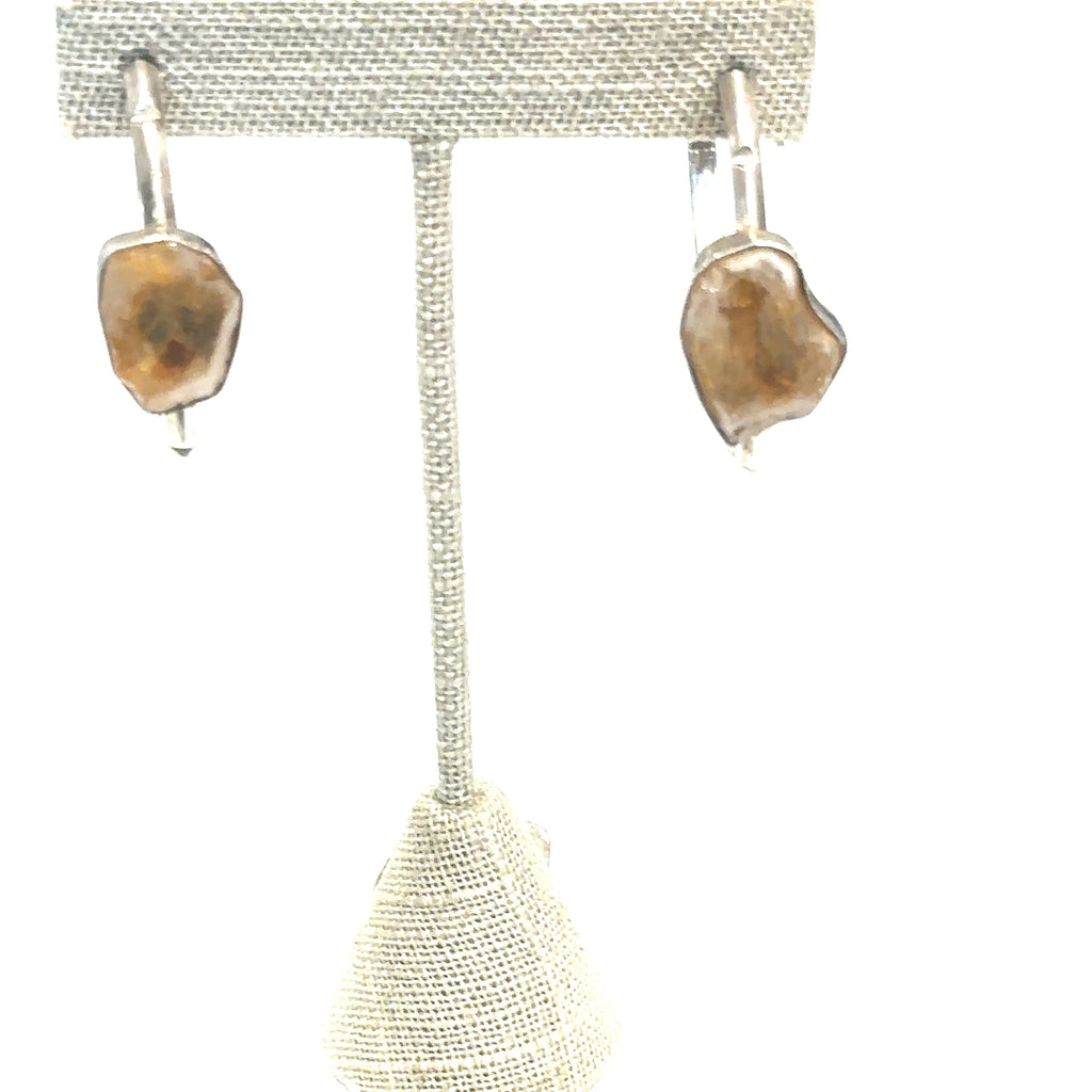 Raw slice citrine hoop studs, 1.75 inch diameter on white on earing tree for close up front view