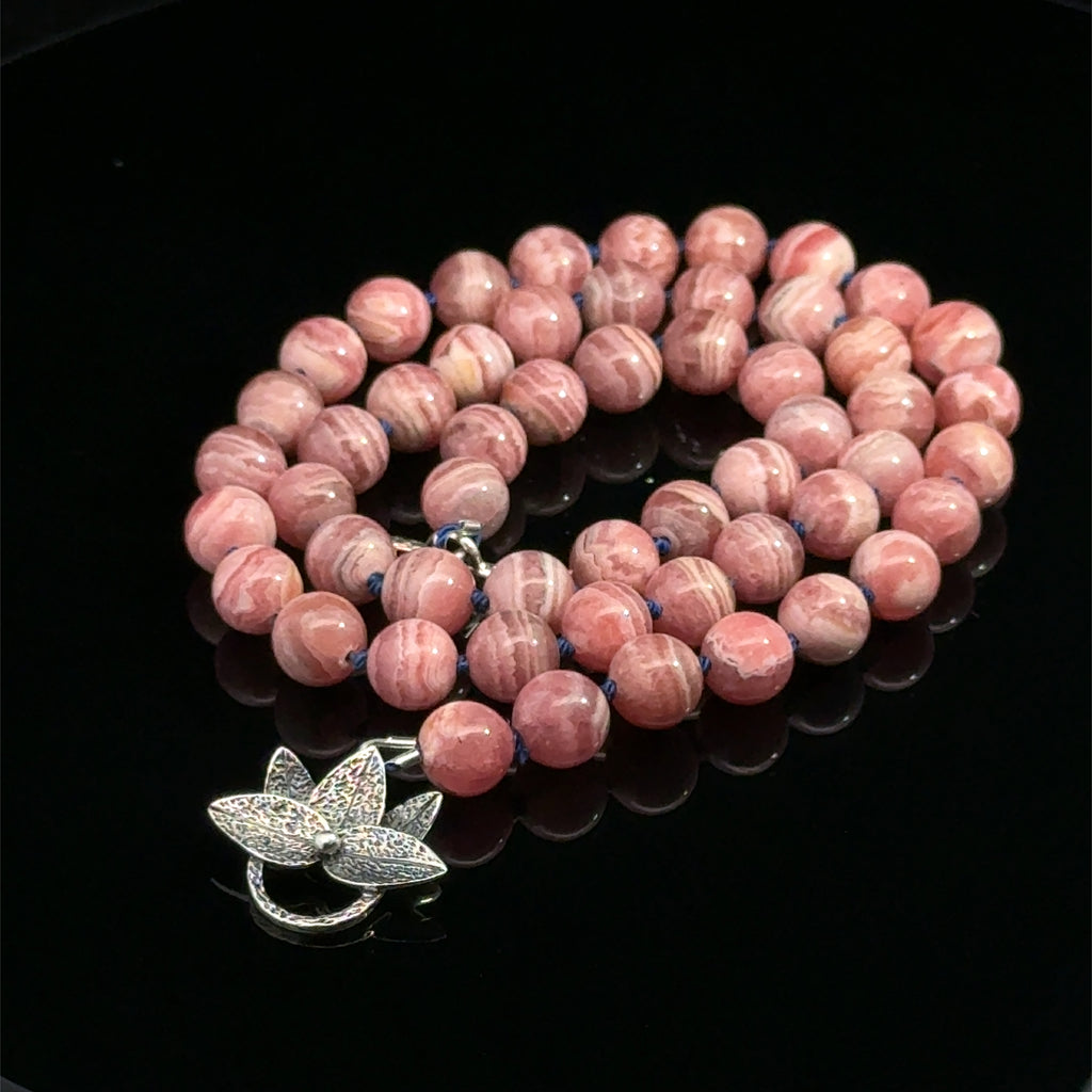 Rhodochrosite Gemstone Necklace on black left side
