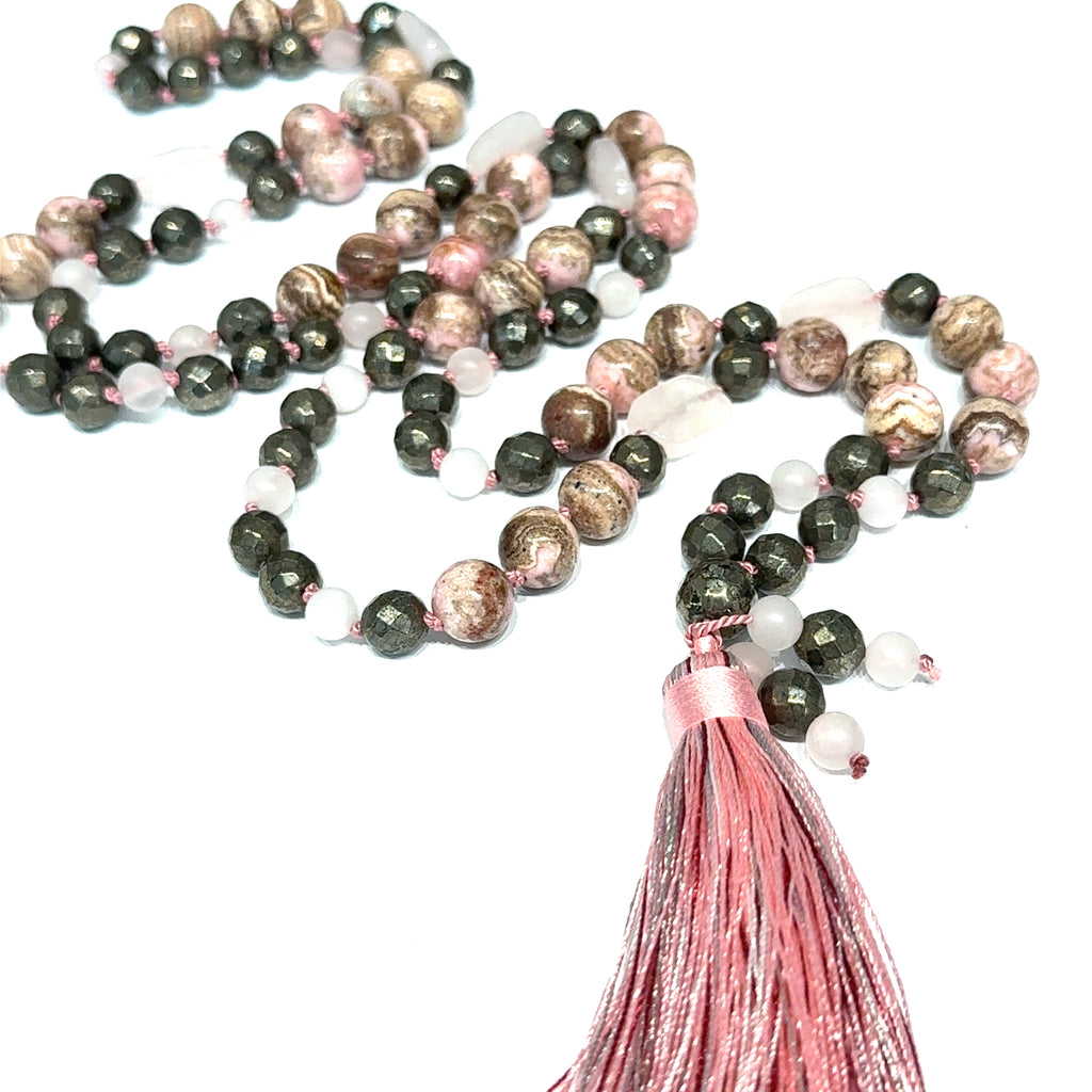 Rhodochrosite, Rose Quartz & Pyrite Mala Necklace on white center close up overview