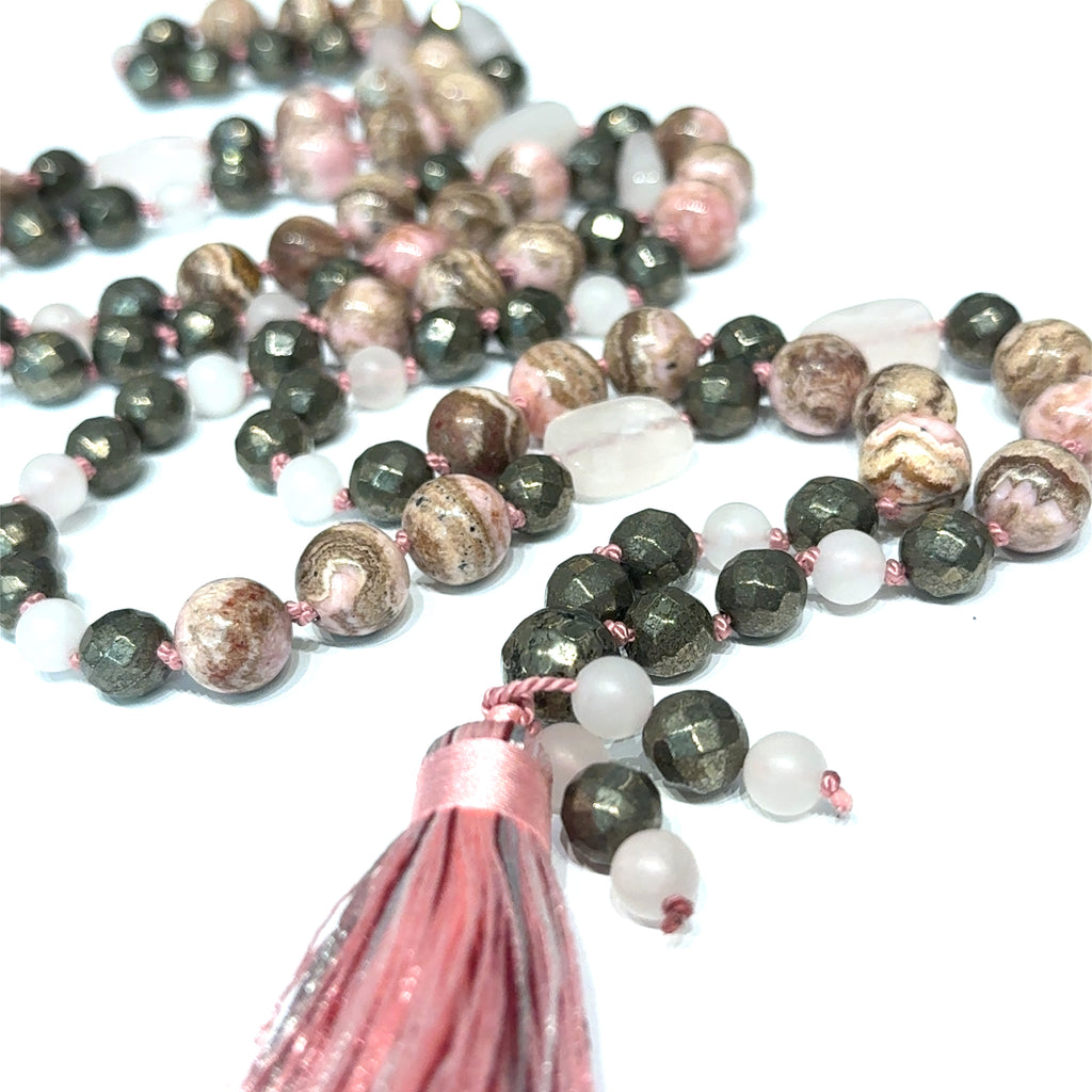 Rhodochrosite, Rose Quartz & Pyrite Mala Necklace on white center close up tassel  overview