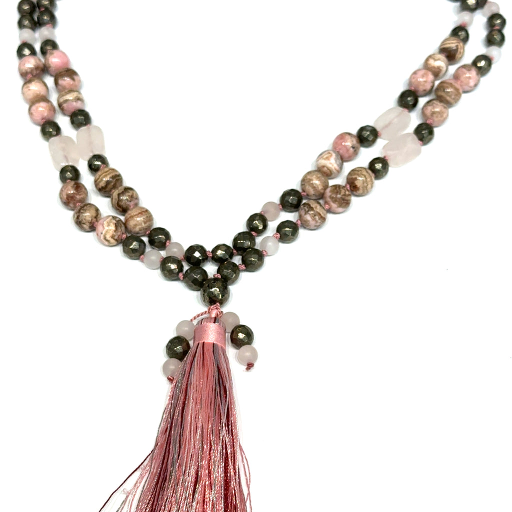 Rhodochrosite, Rose Quartz & Pyrite Mala Necklace on white hanging overview