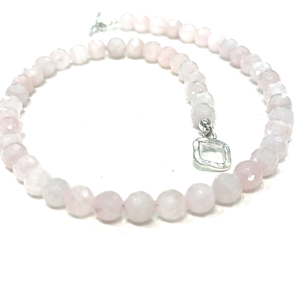 Rose Quartz 8mm faceted gemstone beaded necklace with sterling silver toggle clasp, 16.5 inches long on white spiral center overview