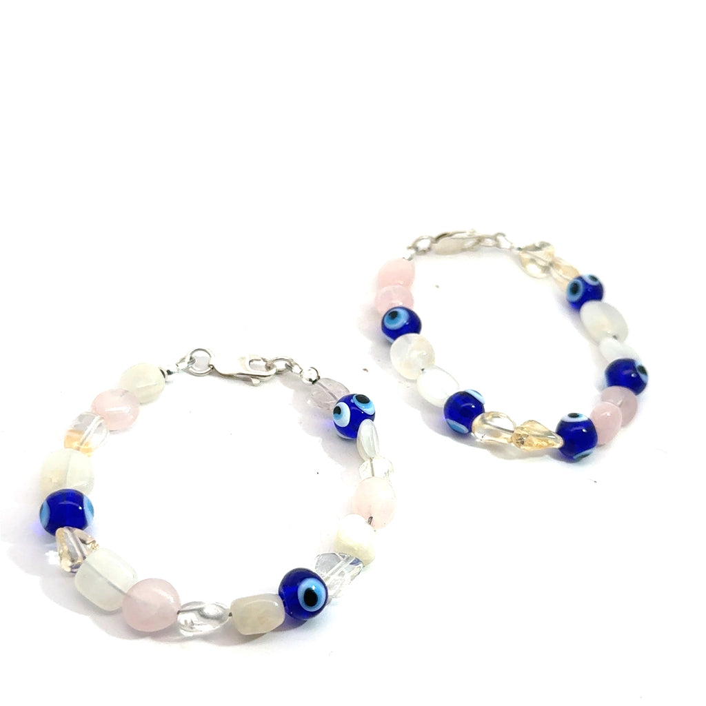 Rose Quartz,  Clear Quartz, Citrine Gemstone, evil eye  Bracelet on white grouping overview