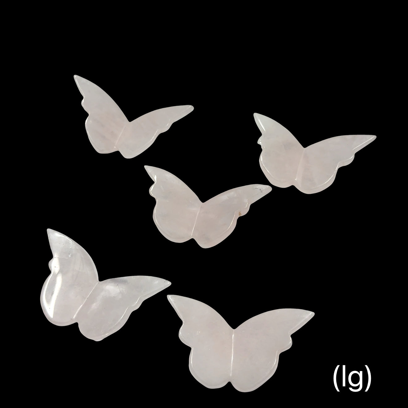 Rose Quartz butterfly-shaped crystals (lg) on a black background, front view.