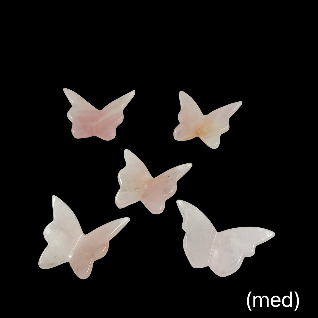 Rose Quartz butterfly-shaped crystals (med) on a black background, front view.