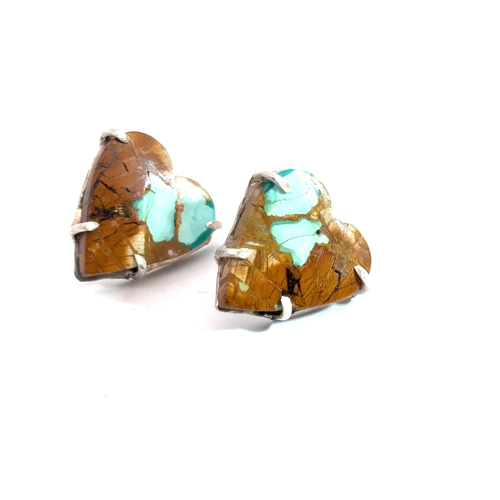 Royston Turquoise heart earrings in sterling silver — handcrafted by Hidden Jewel Boston on a white background left angle view. 