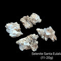 Selenite crystal from Santa Eulalia Mexico in translucent white for crown chakra activation angelic connection and spiritual clarity with divine light energy (11-20g), on a black background front view. 