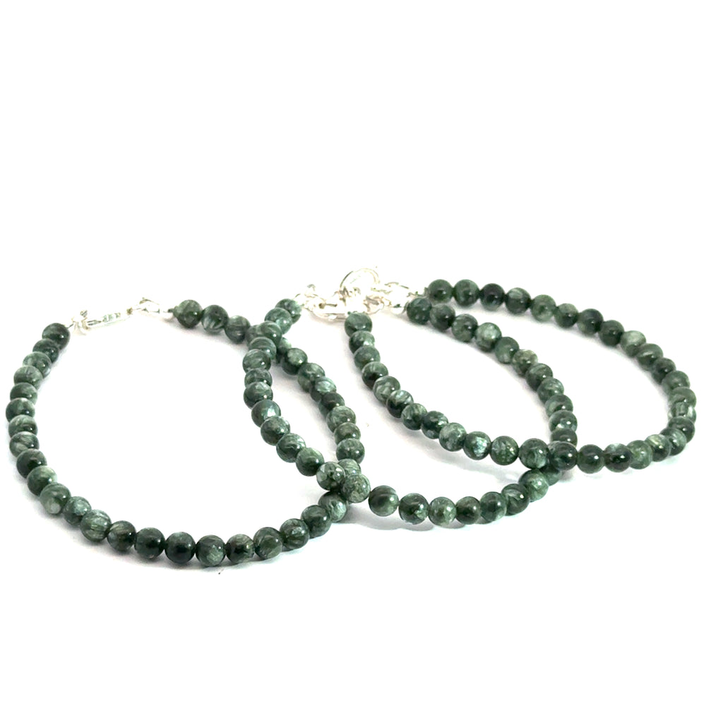 Seraphinite Gemstone Beaded Bracelet on white grouping of front view