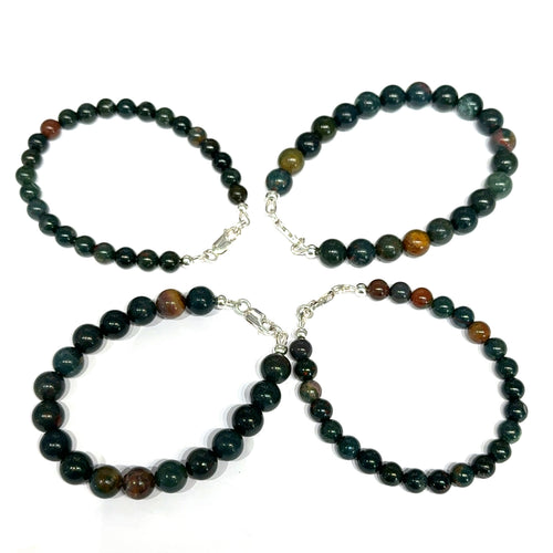 Set of four Bloodstone gemstone beaded bracelets on a white background, front overview. 