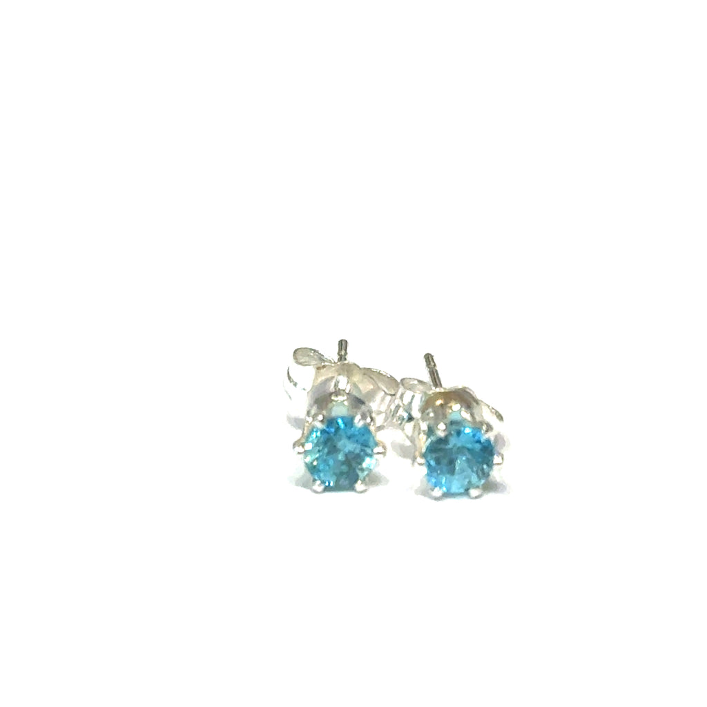 Silver earrings with blue zircon stones on a white background, front overview