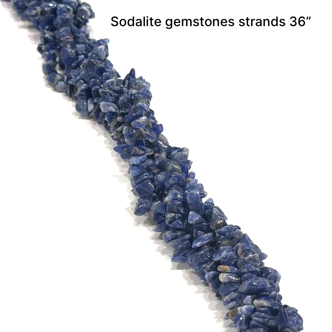  Sodalite chips gemstone strand on a white background, front close up  overview.