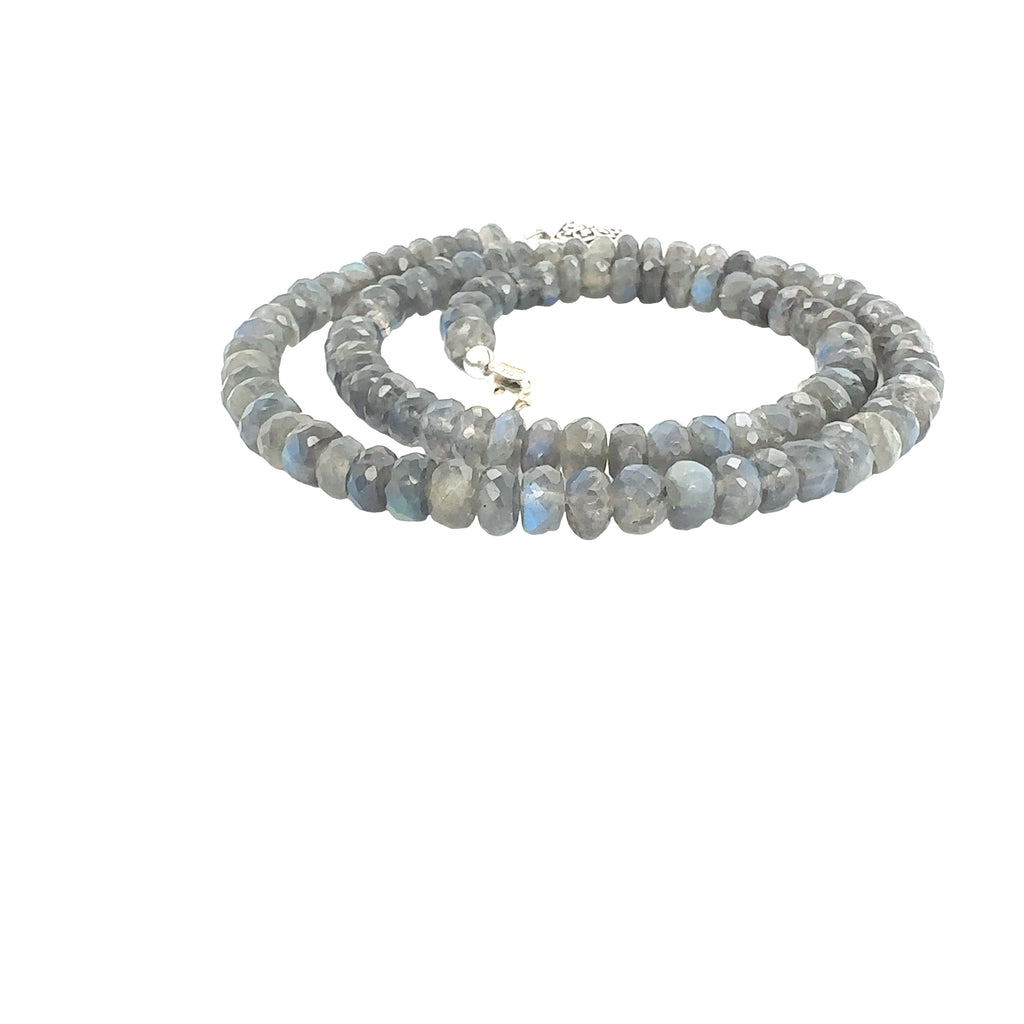 Statement Labradorite necklace with faceted roundel gemstones and sterling silver findings on white spiral overview