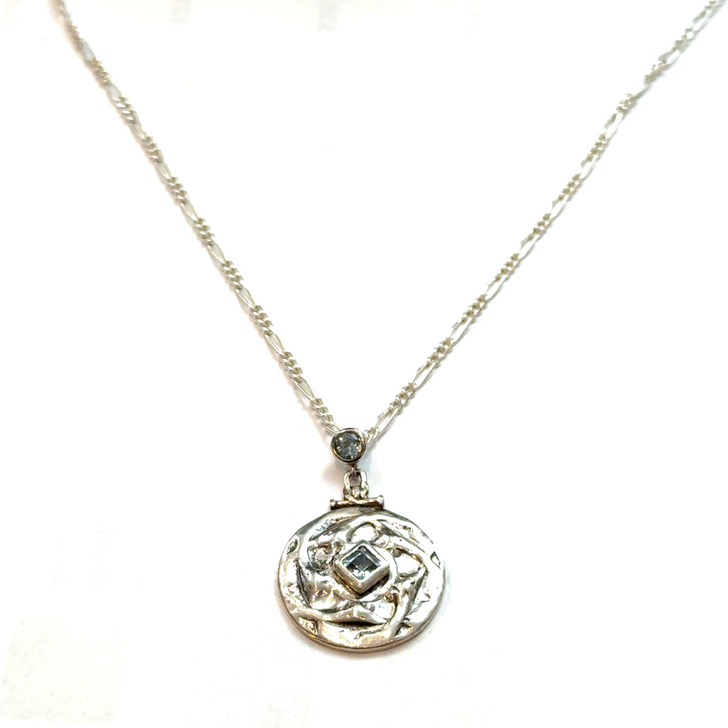 Sterling Silver Blue Topaz Pendant Necklace on white center hanging  overview