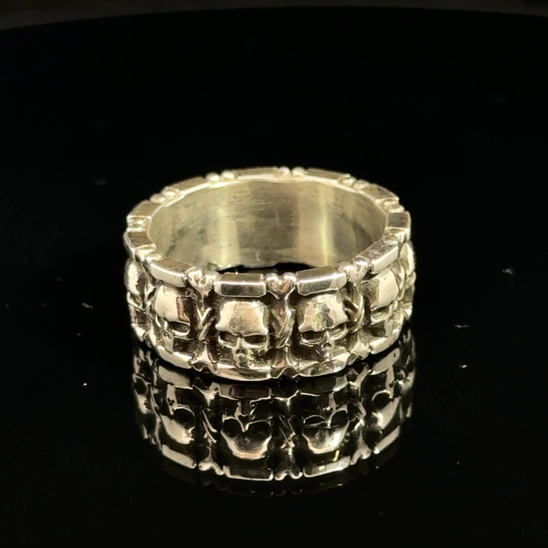Sterling Silver Skull and Bones Ring on black  back 