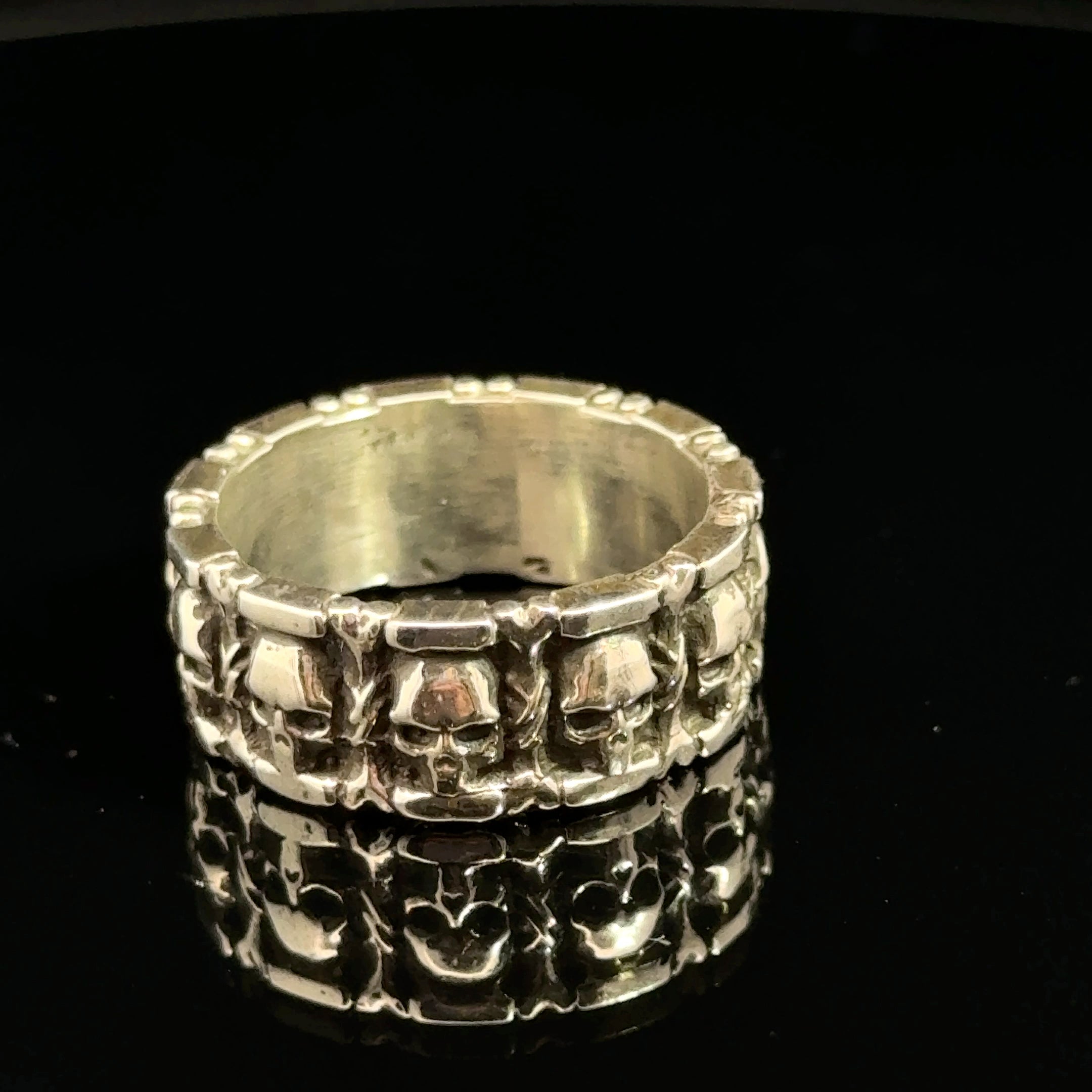 Sterling Silver Skull and Bones Ring on black  back right side