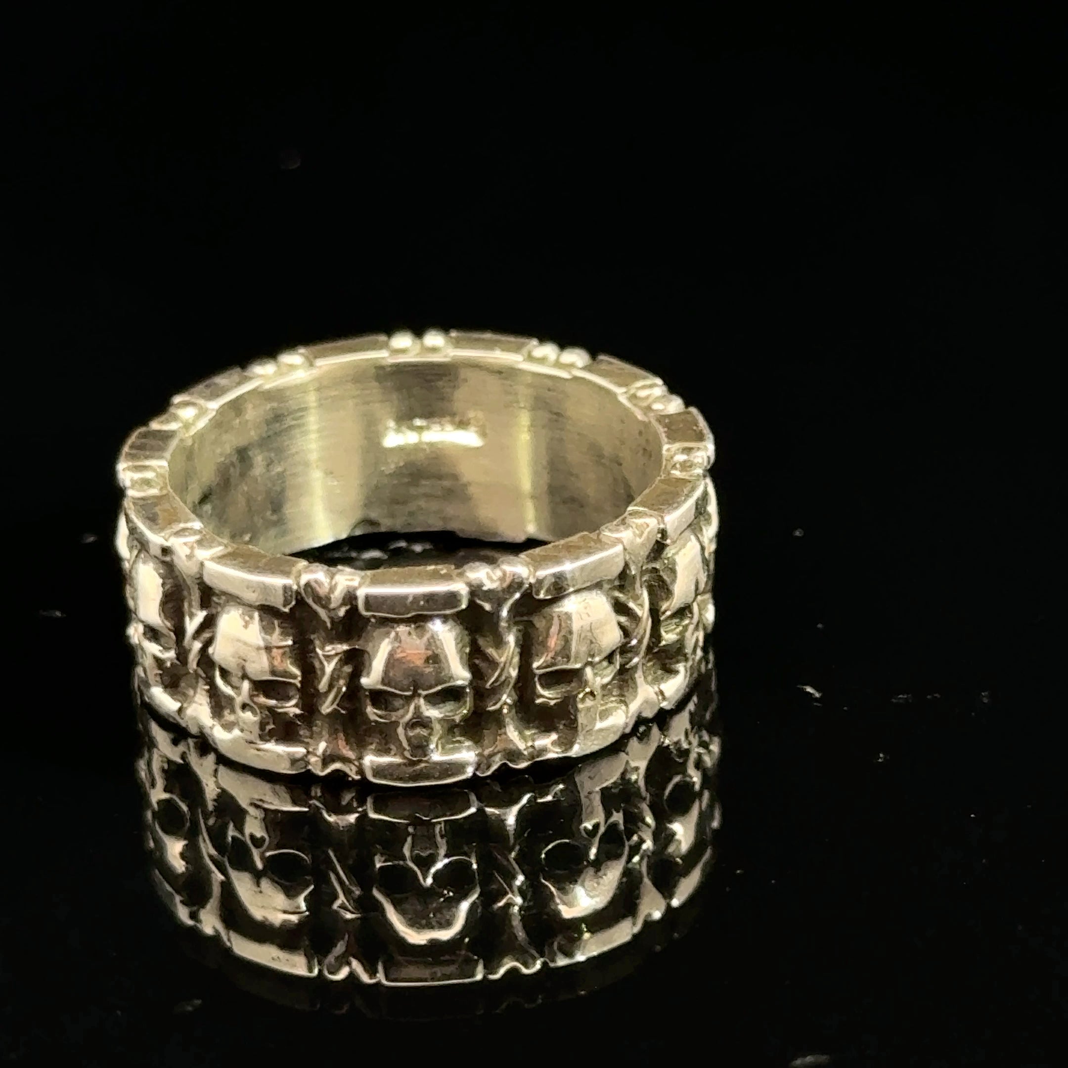 Sterling Silver Skull and Bones Ring on black front overview