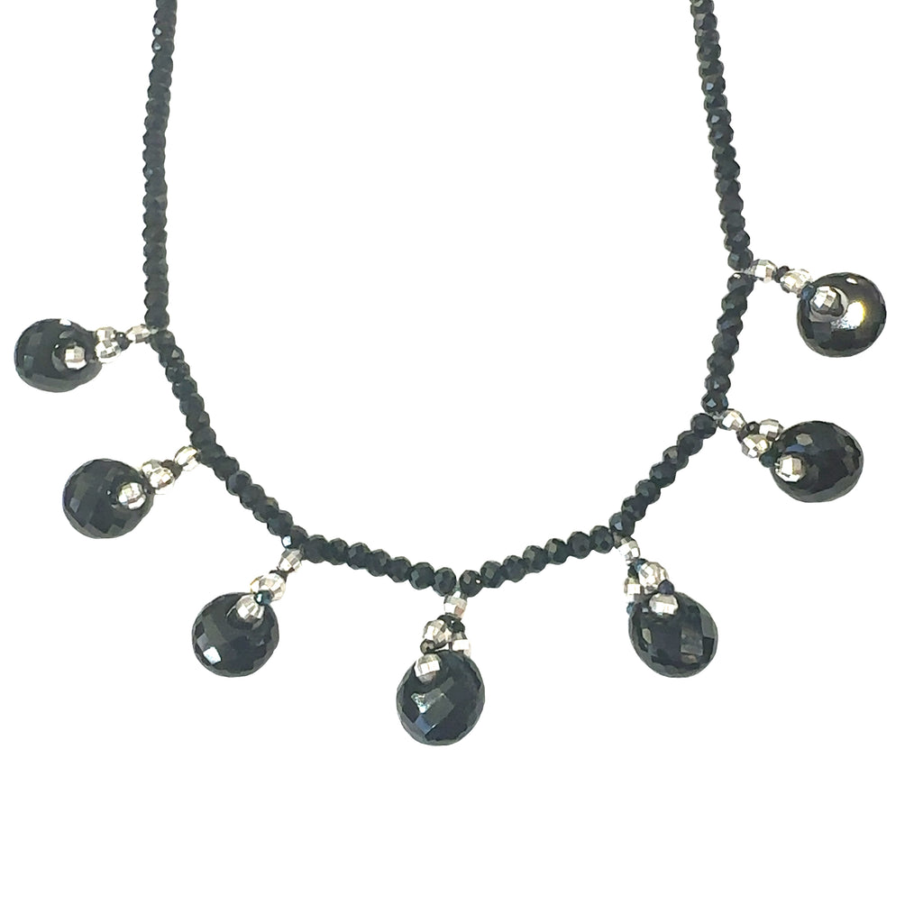 Sterling silver accented Black Spinel and Tourmaline necklace for chakra healing and grounding on white hanging overview