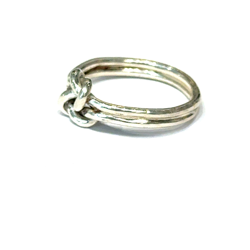 Sterling silver double knot ring handcrafted by Ivy Rose on a white background  right side, close up overview. 