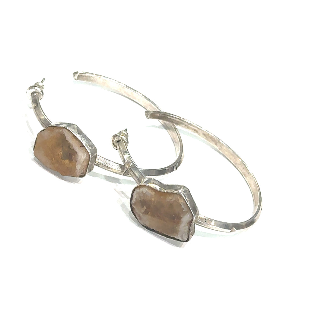 Sterling silver hoop stud earrings with raw citrine gemstones on white angled overview