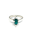 Sterling silver ring with faceted marquis emerald gemstone on a white background front, close up view.