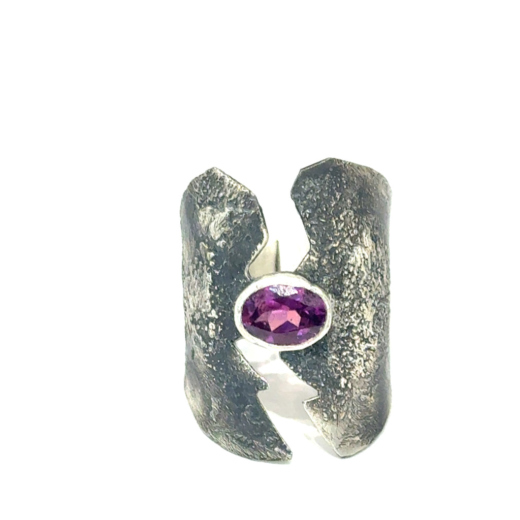 Sterling silver shield ring with almandine garnet center (size 6.5) on a white background, front, overview. 