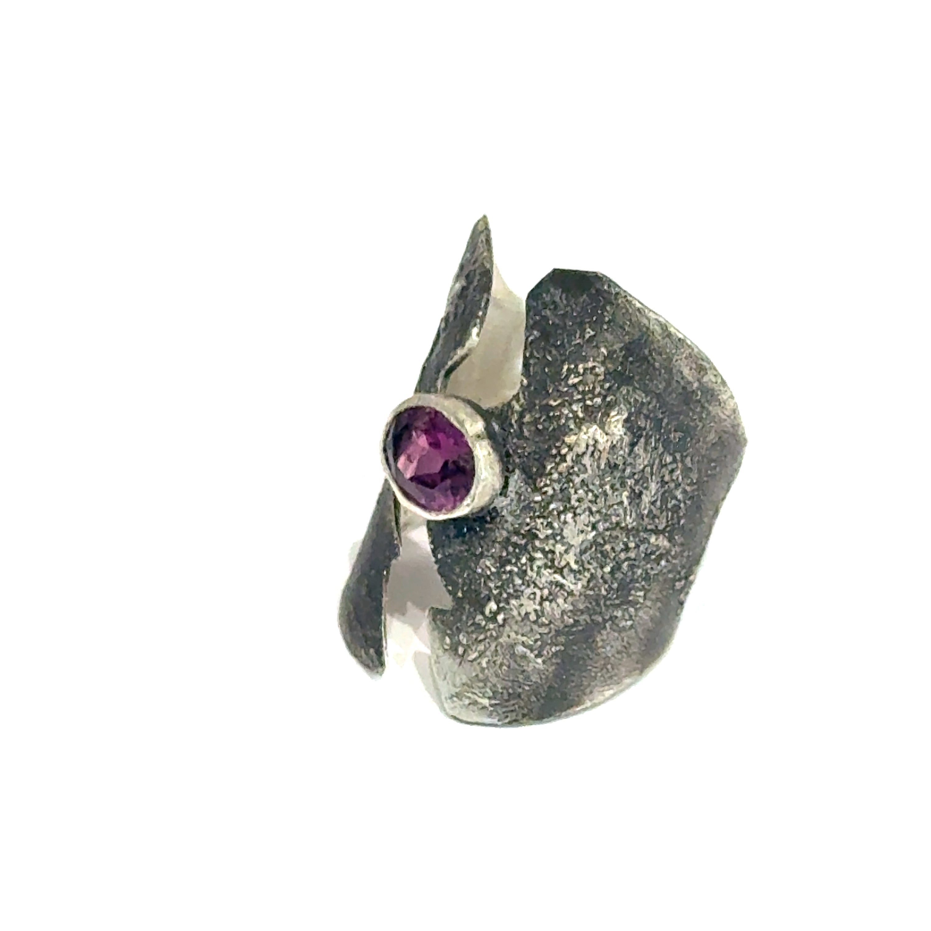 Sterling silver shield ring with almandine garnet center (size 6.5) on a white background, left angle  front, overview. 