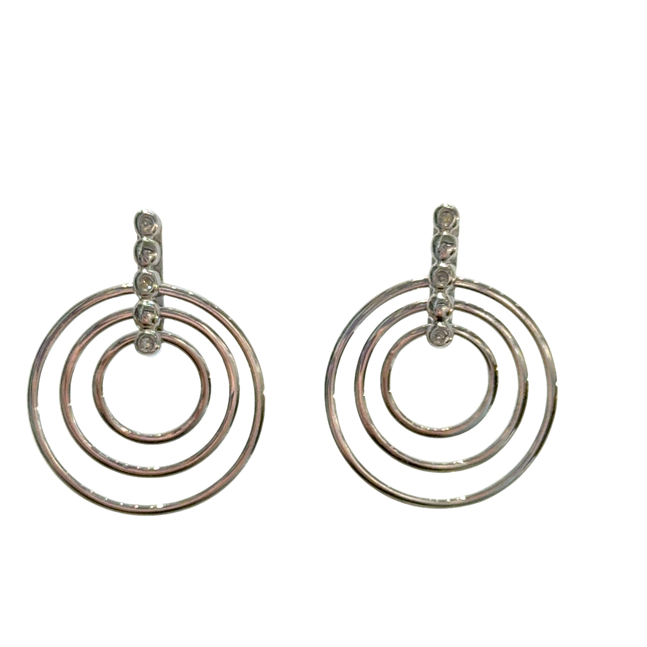 Sterling silver triple concentric circle stud earrings with three diamond accents on bar post on a white background, front view.