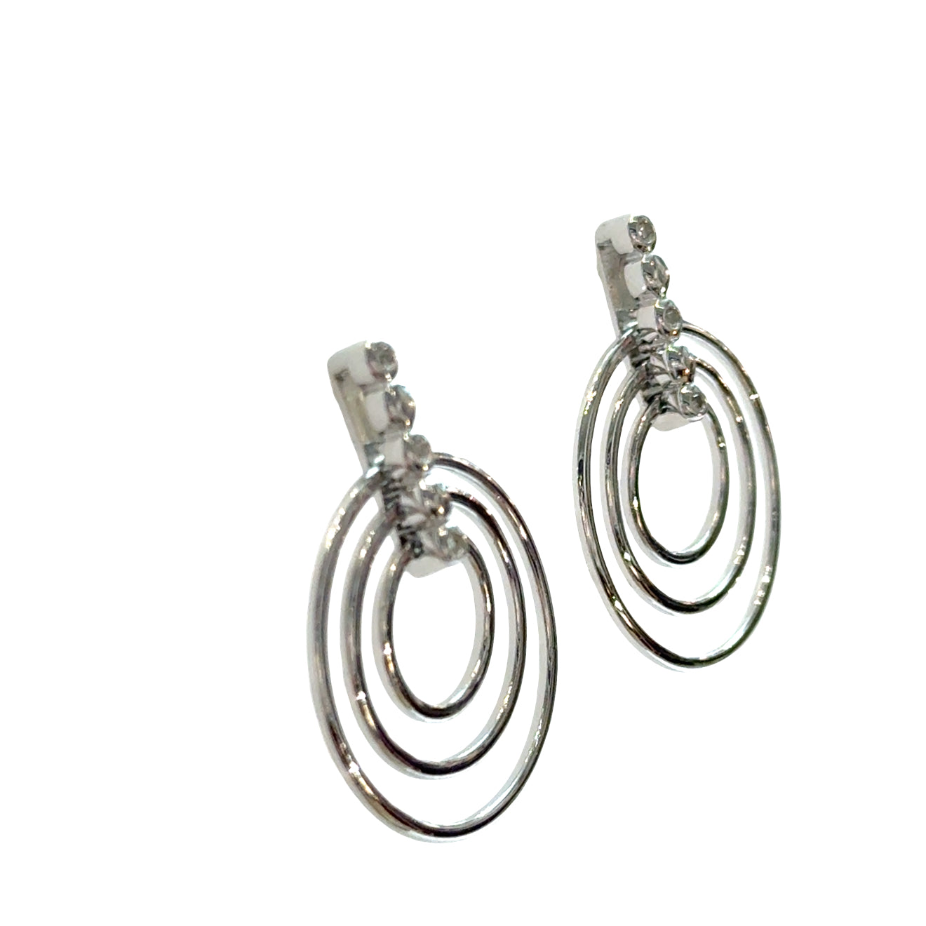 Sterling silver triple concentric circle stud earrings with three diamond accents on bar post on a white background, right angle view.