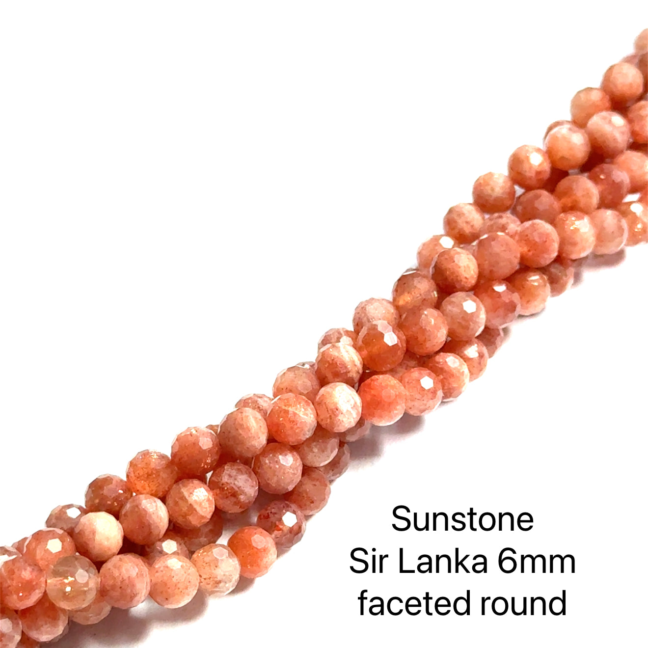 Sunstone 6mm faceted round gemstone strand on a white background, front overview. 