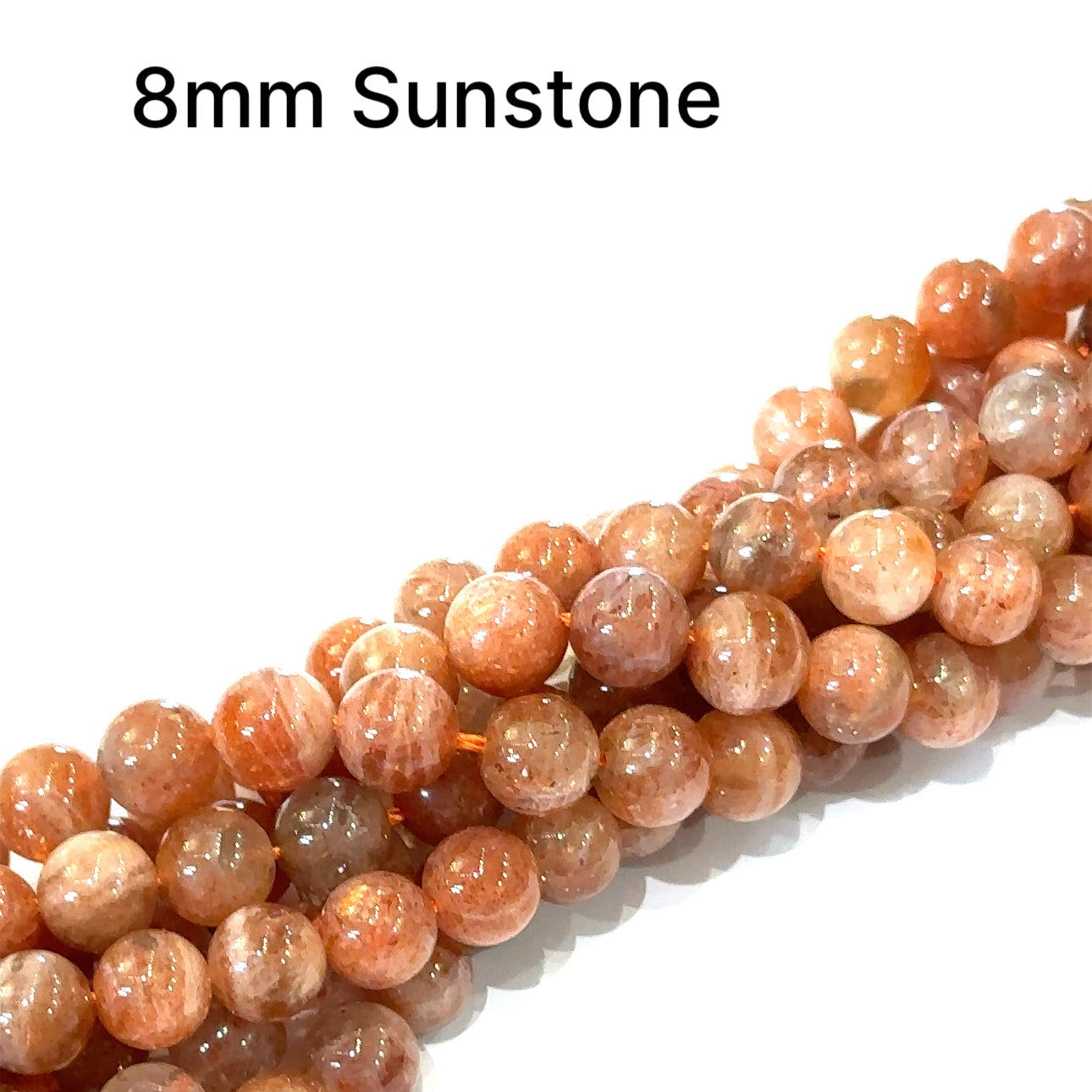 Sunstone 8mm smooth round gemstone strand on a white background, front overview. 