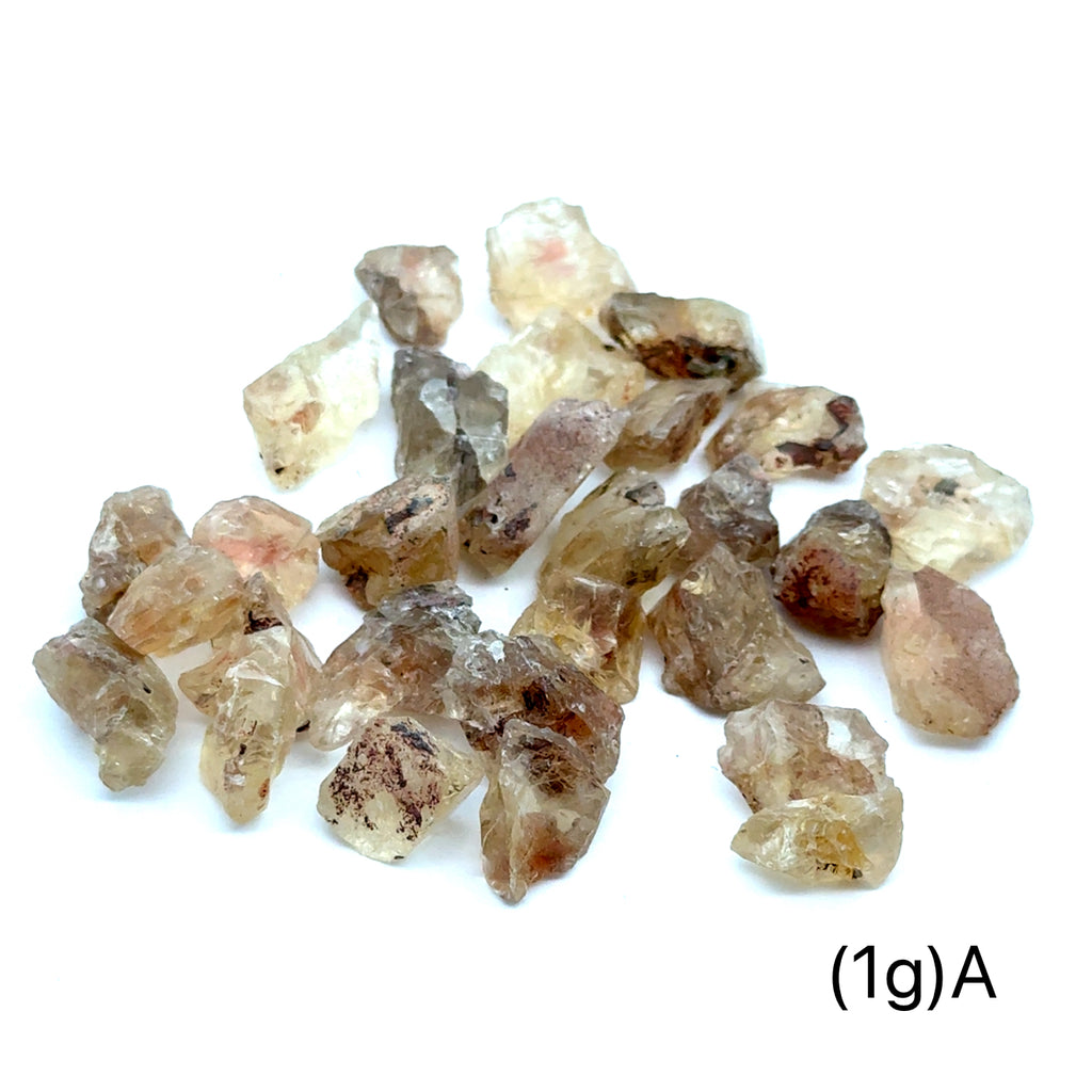 Sunstone Raw Gemstone from Oregon grouping (1g)A  on white front overview