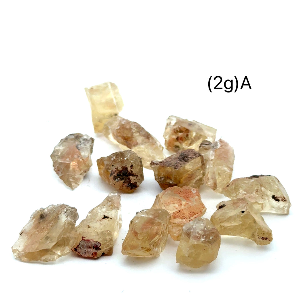 Sunstone Raw Gemstone from Oregon grouping (2g)A  on white front overview
