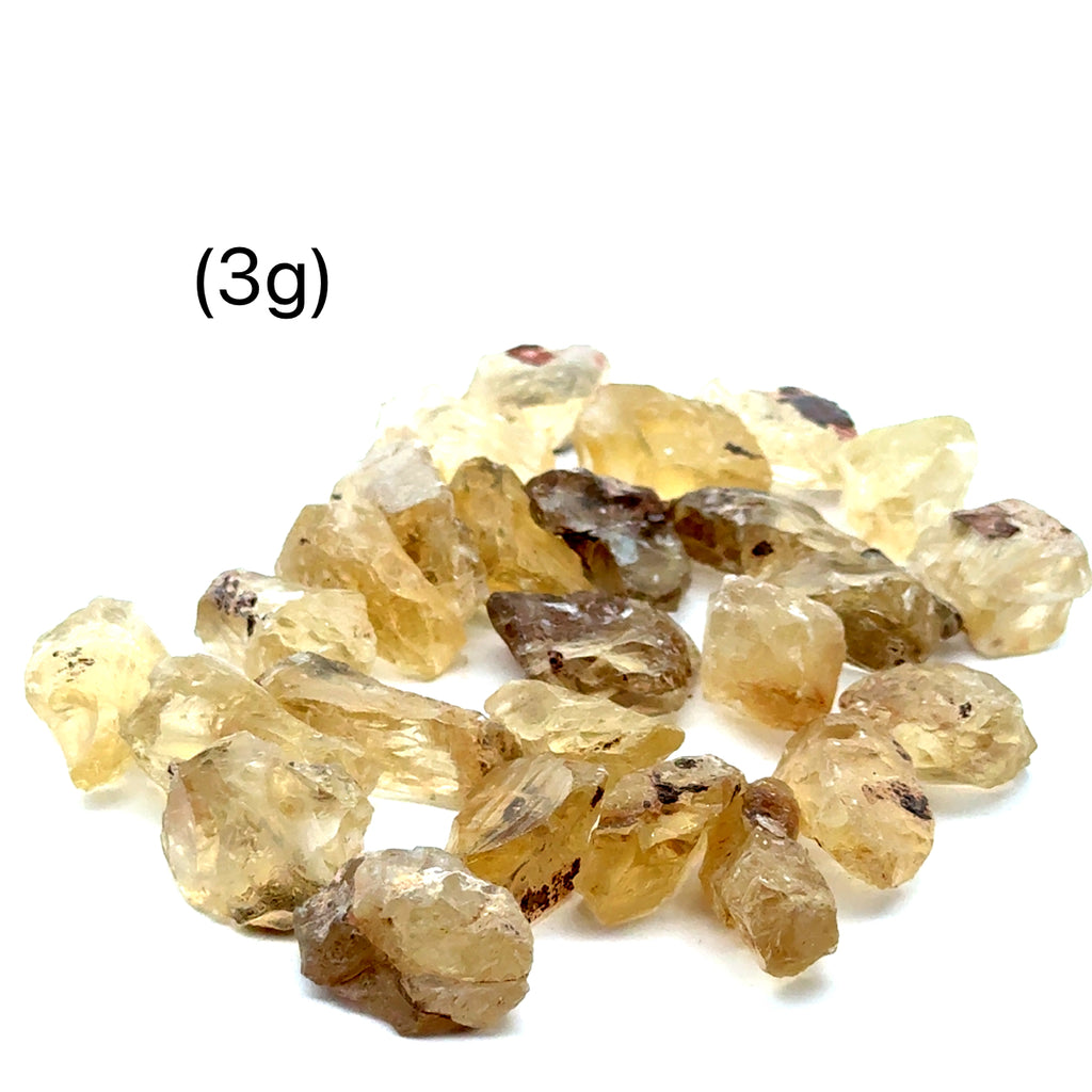 Sunstone Raw Gemstone from Oregon grouping (3g)  on white front overview