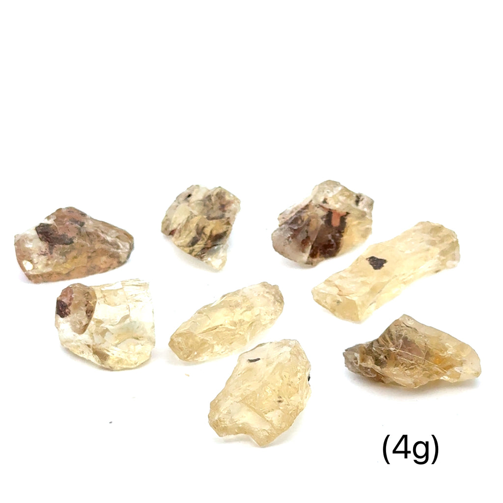 Sunstone Raw Gemstone from Oregon grouping (4g)  on white front overview