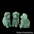 Three  Green Aventurine hound Dog gemstone carving on Black background, front view.